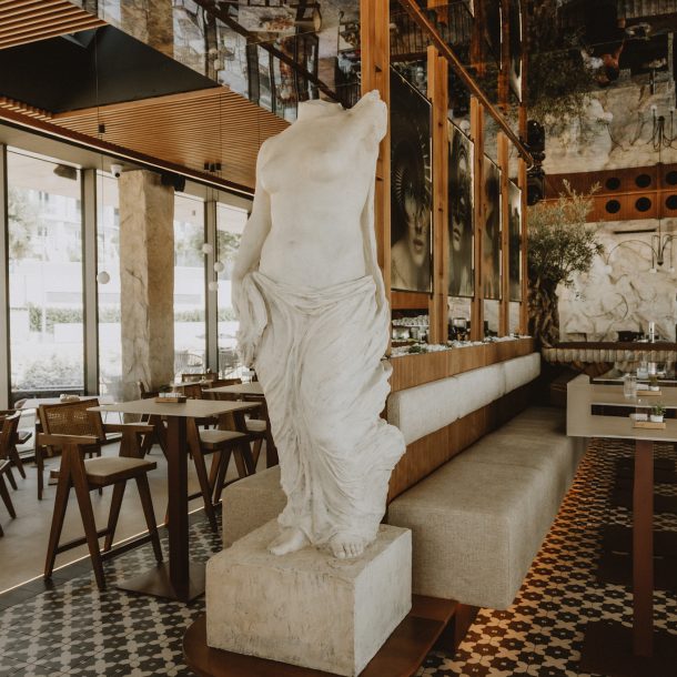 Elegant marble statue centerpiece inside Gal Split café-lounge