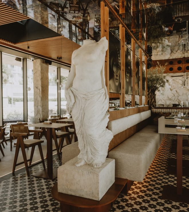 Elegant marble statue centerpiece inside Gal Split café-lounge