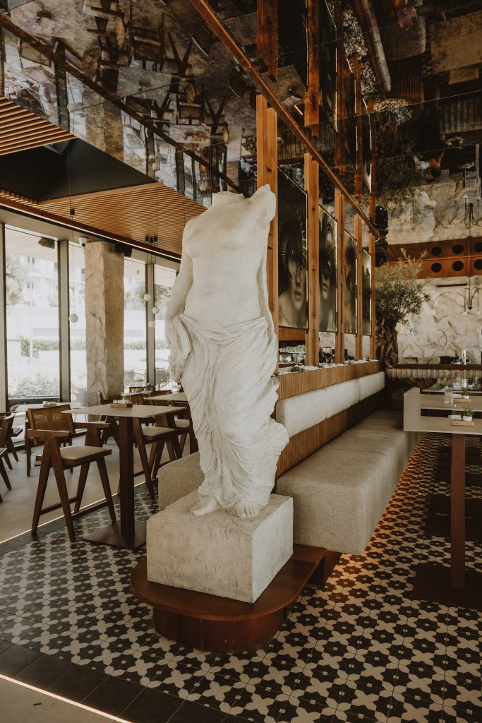 Elegant marble statue centerpiece inside Gal Split café-lounge