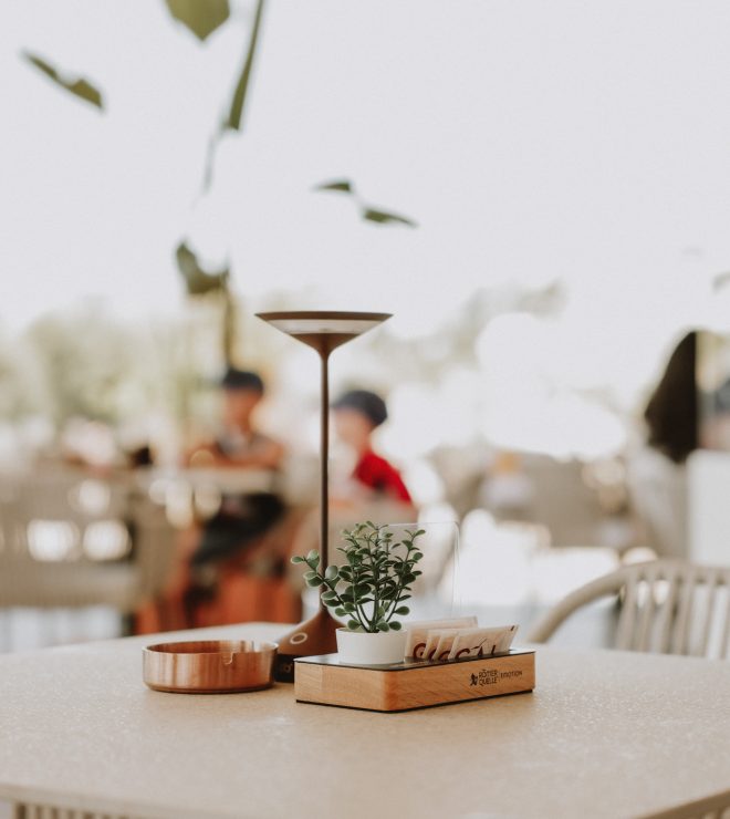 Outdoor table setup with lamp and plant at GAL Split